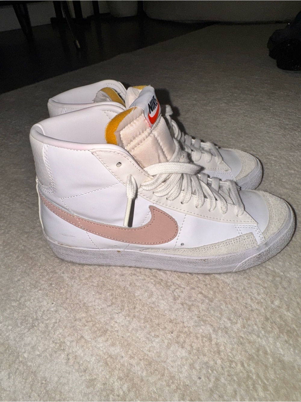 Nike Blazers women’s White High-Top Sneakers with Pink Swoosh